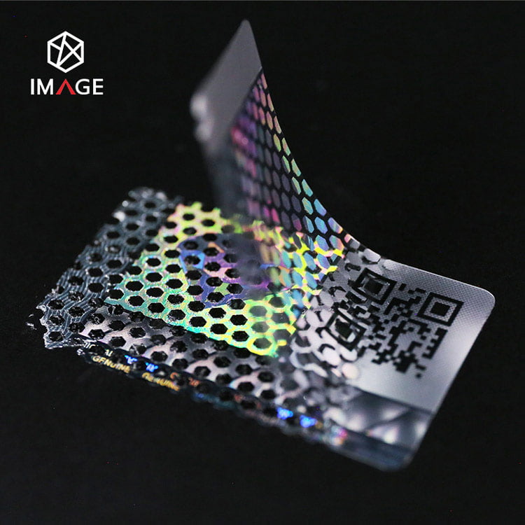 QR code hologram sticker, leaves honeycomb pattern if removed