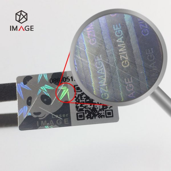 hologram tamper proof destructible sticker, hidden information is visible under magnifying glass