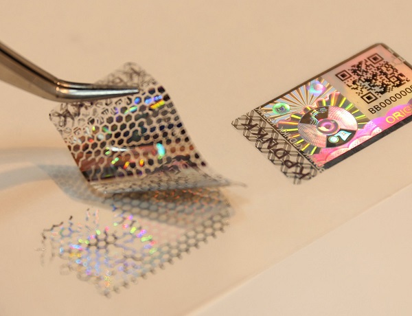 holographic labels with anti-tampering feature, honeycomb pattern as evidence of tamper