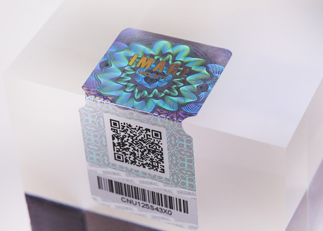 a hologram sticker with a qr code and barcode