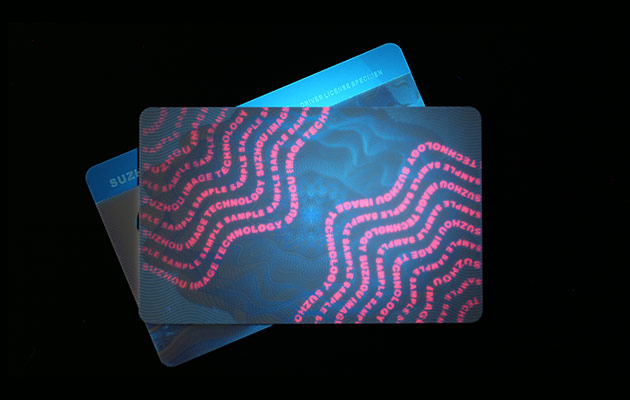 embedded laminate overlay with fluorescent ink printing