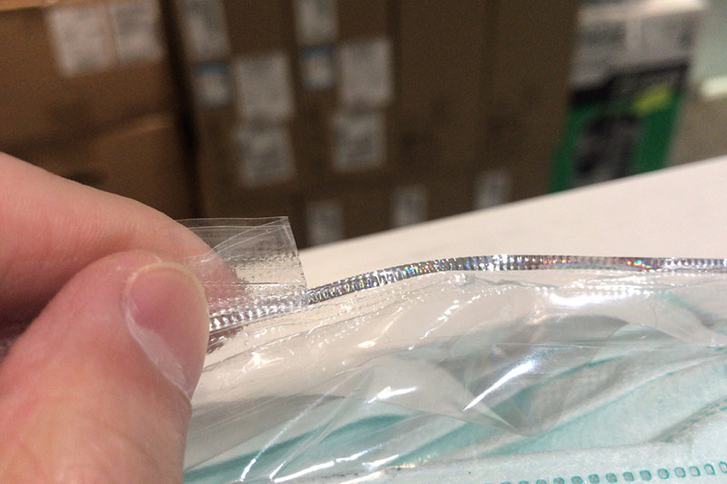optical security tear strips for mask packaging