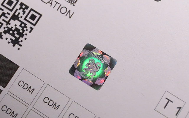 Inner pages are affixed with custom holographic stickers for multiple security
