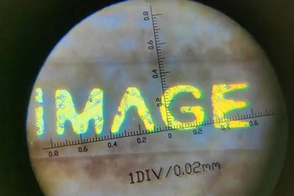 anti-counterfeiting threads with micro text technology, hidden text is visible under 80x magnifier