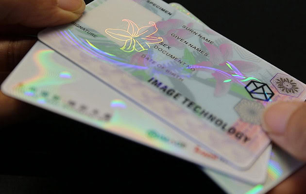 Pre-printed ID card with a hologram patch overlay for added document security